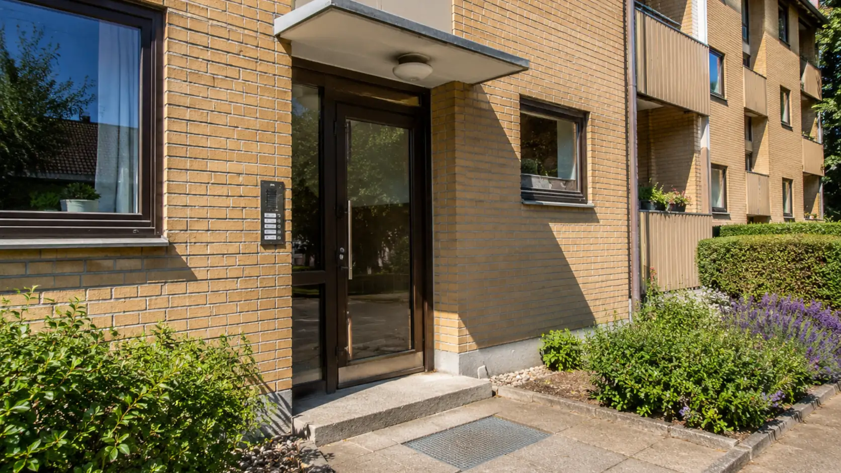Close to the entrance of some apartments